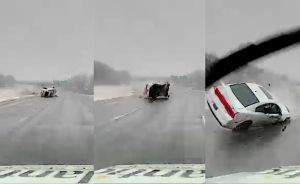 Car flipping across highway narrowly misses ambulance (video)