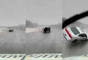 Car flipping across highway narrowly misses ambulance (video)