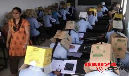 Tələbələrin başlarına qutu keçirib imtahana saldılar — FOTO