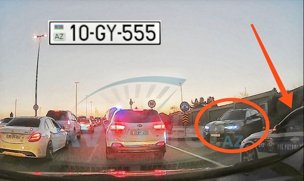 Bakıda məmur qaydaları KOBUD ŞƏKİLDƏ POZDU: maşını yol polisinin üstünə sürdü - VİDEO