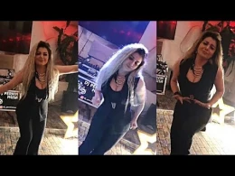 Azərbaycanlı müğənni əlində içki kişilərin qucağında rəqs etdi