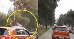 Bakıda qızdan inanılmaz hərəkət: Maşının üstünə çıxıb...(VİDEO)