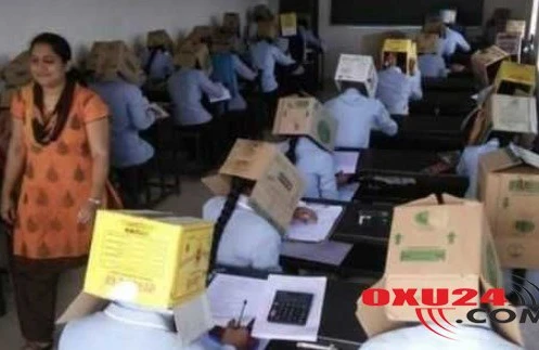 Tələbələrin başlarına qutu keçirib imtahana saldılar — FOTO