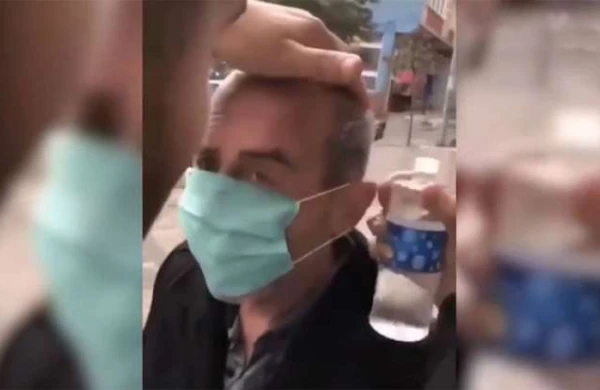 Qocanın üzünə zorla maska taxıb, başına odekolon tökdülər - VİDEO